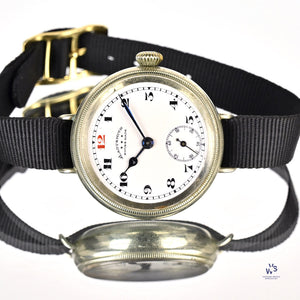 Ladysmith Swiss MadeScrew Case Trench Watch With Red 12(Needs Research) - Vintage Watch Specialist